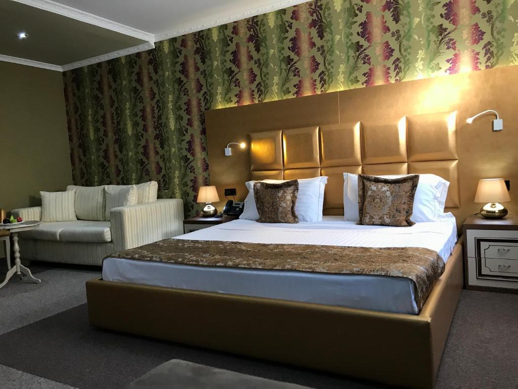 Postel nebo postele na pokoji v ubytování Hotel Deluxe