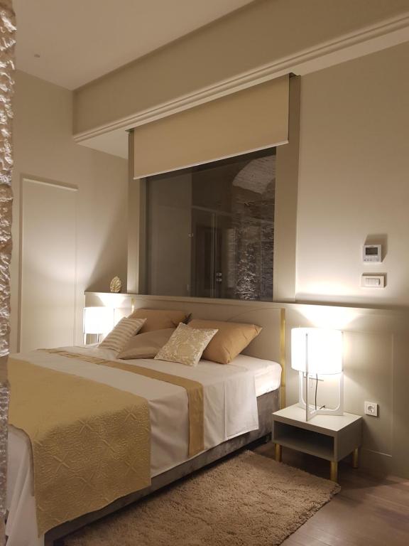 Postel nebo postele na pokoji v ubytování Riva Palace