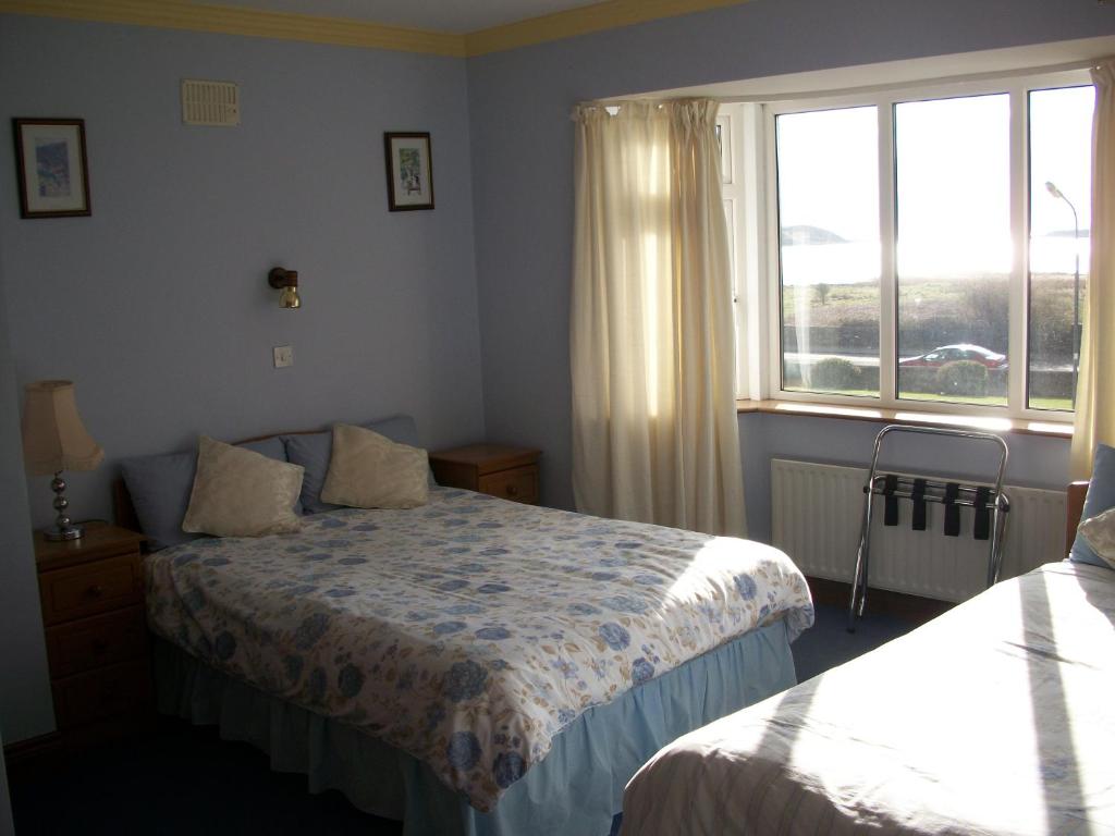 Postel nebo postele na pokoji v ubytování Seashore Lodge Guesthouse