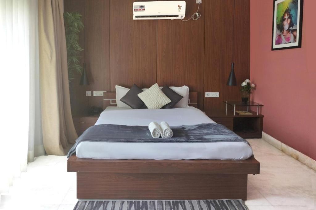 Postel nebo postele na pokoji v ubytování Tatvam Residency