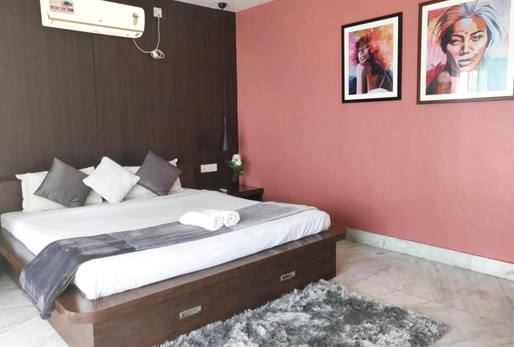 Postel nebo postele na pokoji v ubytování Tatvam Residency