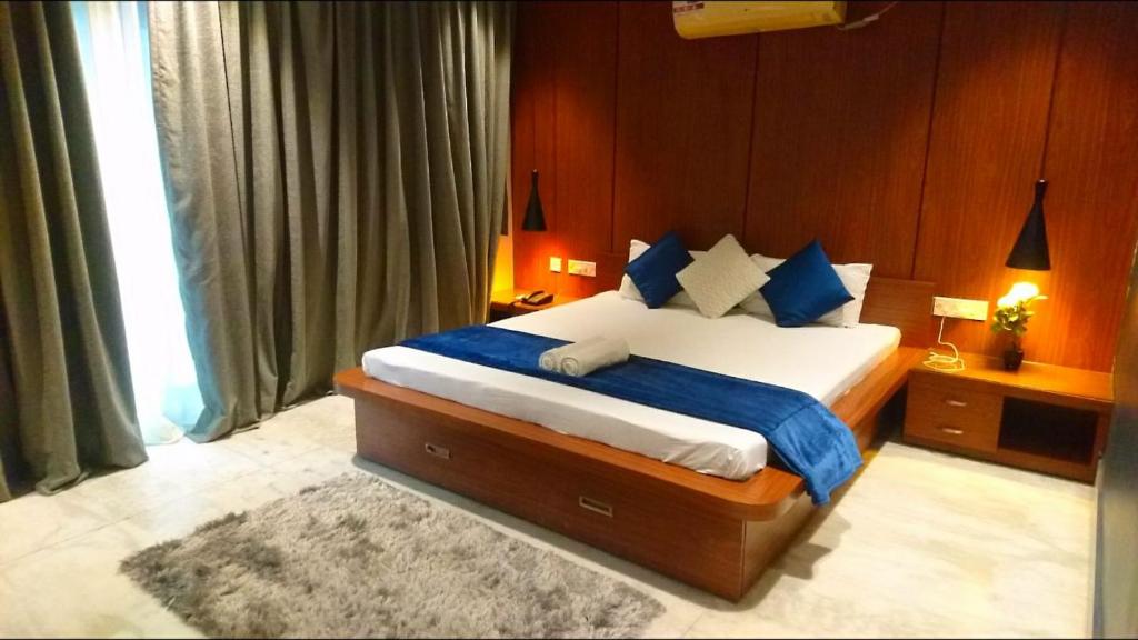 Postel nebo postele na pokoji v ubytování Tatvam Residency