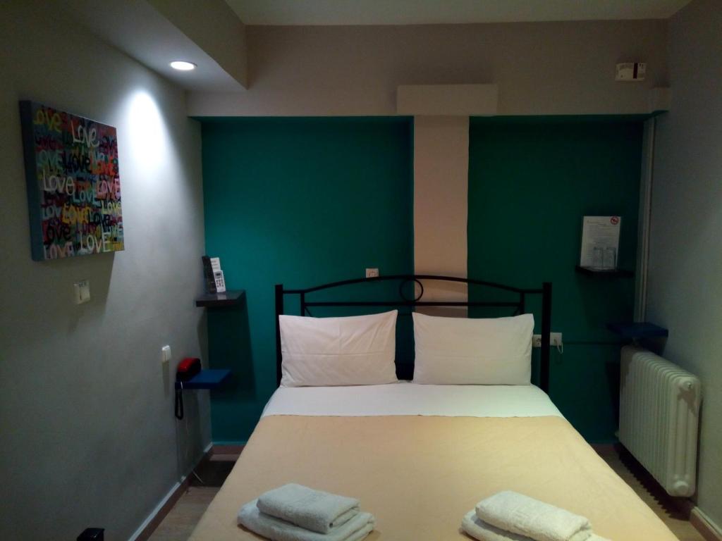 Posteľ alebo postele v izbe v ubytovaní Zappion Hotel