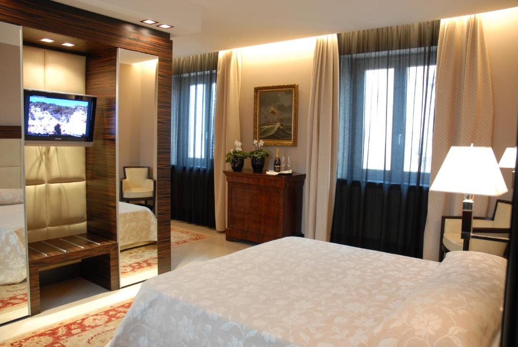 Postel nebo postele na pokoji v ubytování Hotel Excelsior