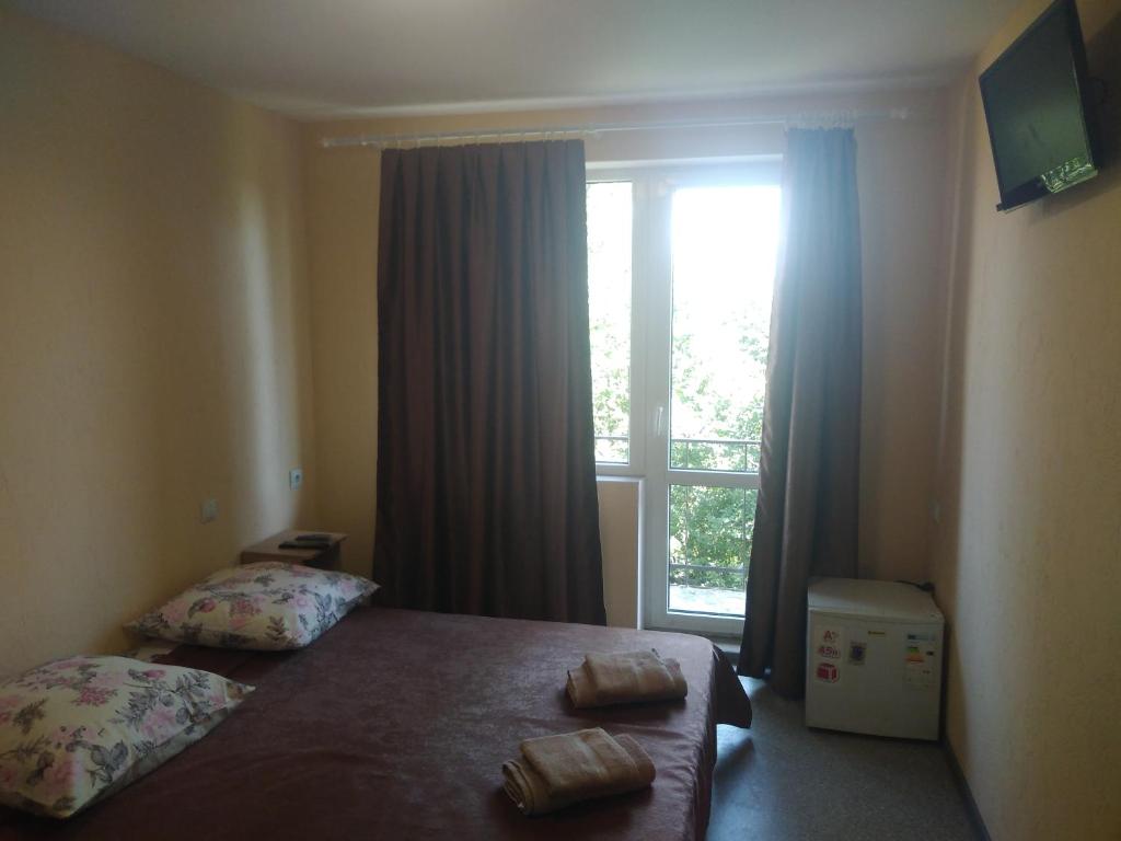 Postel nebo postele na pokoji v ubytování Mini gostinitsa HOSTEL