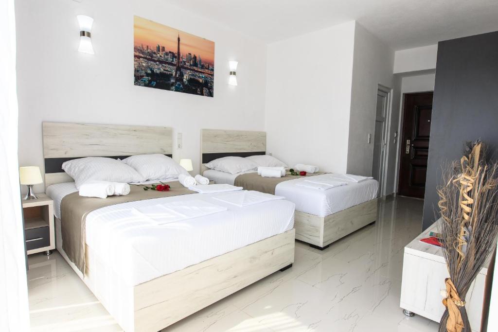 Postel nebo postele na pokoji v ubytování Zara apartmani Sutomore
