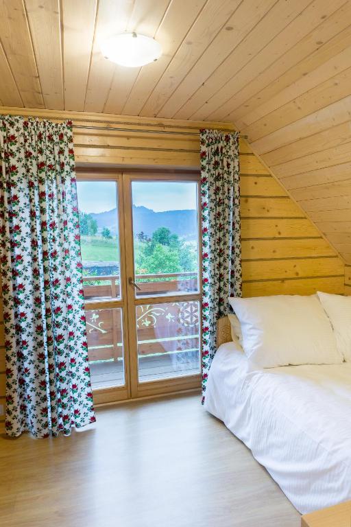 Postel nebo postele na pokoji v ubytování Domki u Huberta