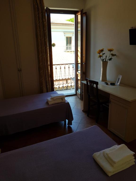 Postel nebo postele na pokoji v ubytování Locanda Aria del Re