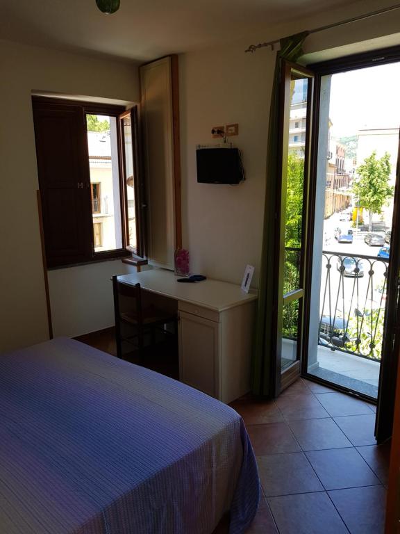 Postel nebo postele na pokoji v ubytování Locanda Aria del Re