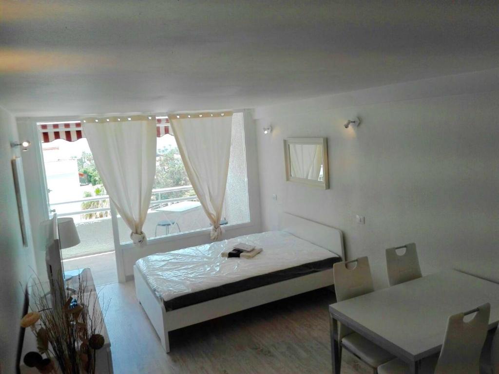 Postel nebo postele na pokoji v ubytování Borinquen Private Homes
