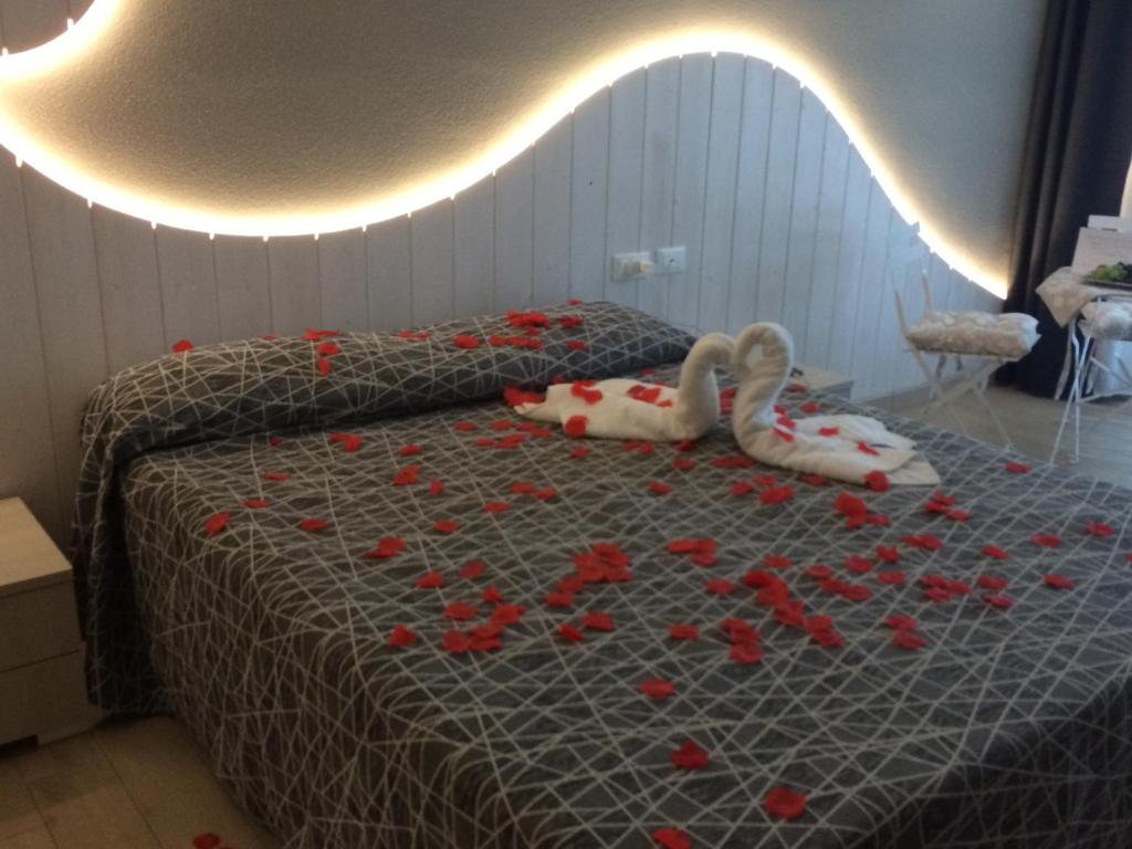 Postel nebo postele na pokoji v ubytování Hotel Letizia