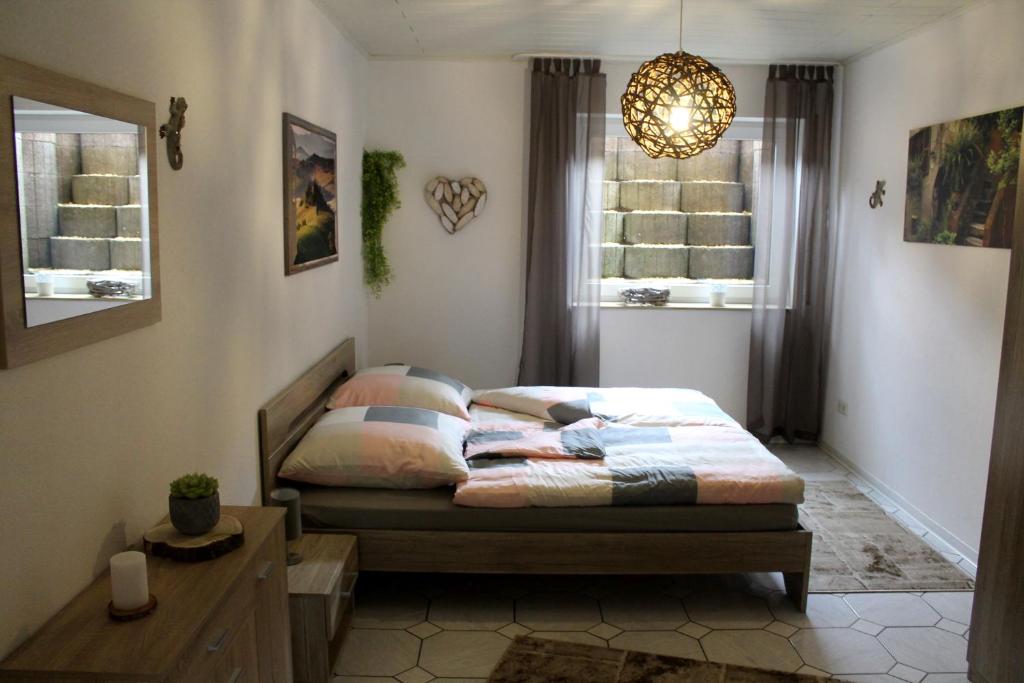 Postel nebo postele na pokoji v ubytování Ferienwohnung " Gecko 2 "