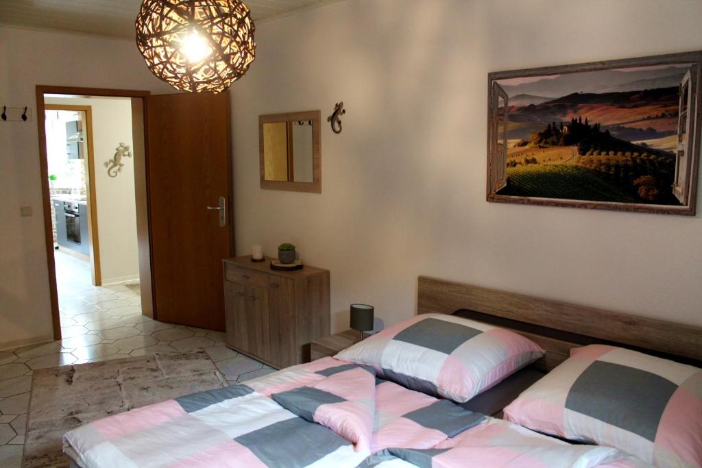 Postel nebo postele na pokoji v ubytování Ferienwohnung " Gecko 2 "