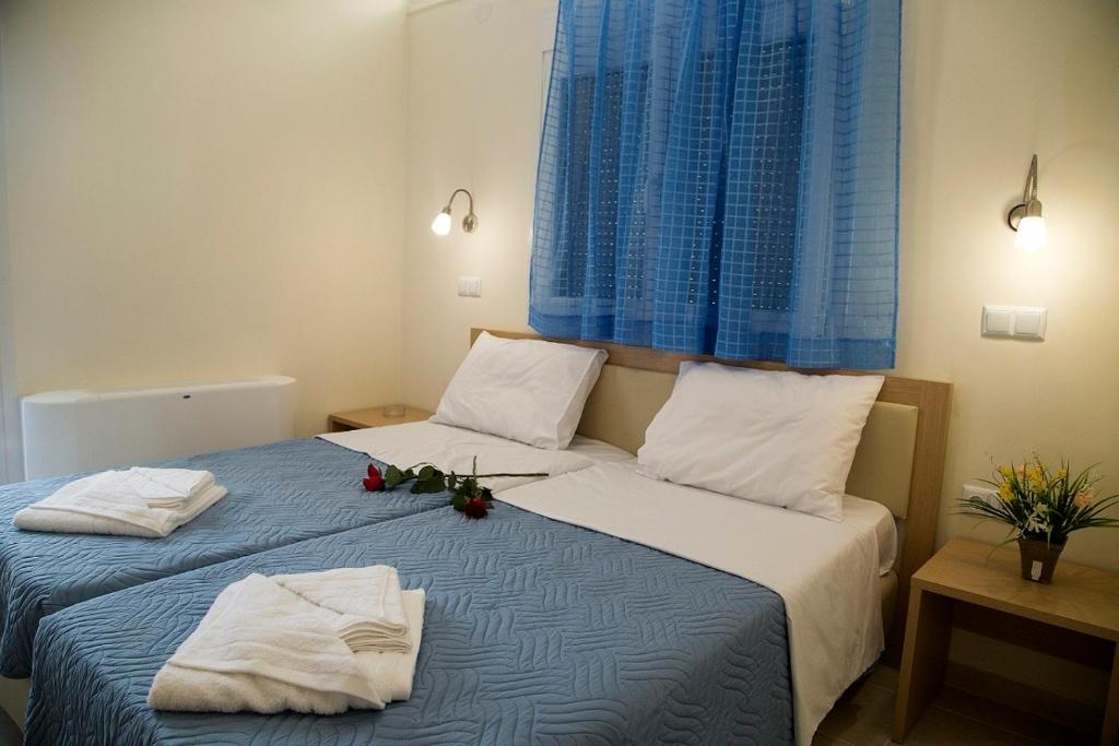 Posteľ alebo postele v izbe v ubytovaní Papatsas Center Houses