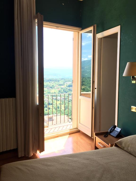 Postel nebo postele na pokoji v ubytování Hotel Relais Filonardi