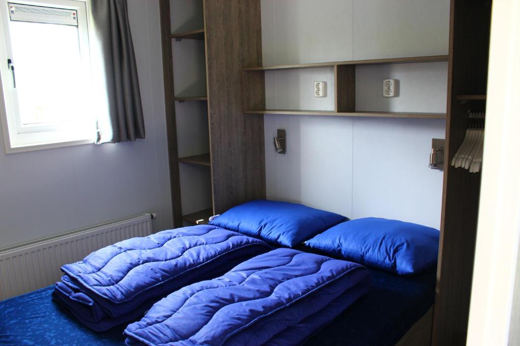 Postel nebo postele na pokoji v ubytování Camping Ginsterveld