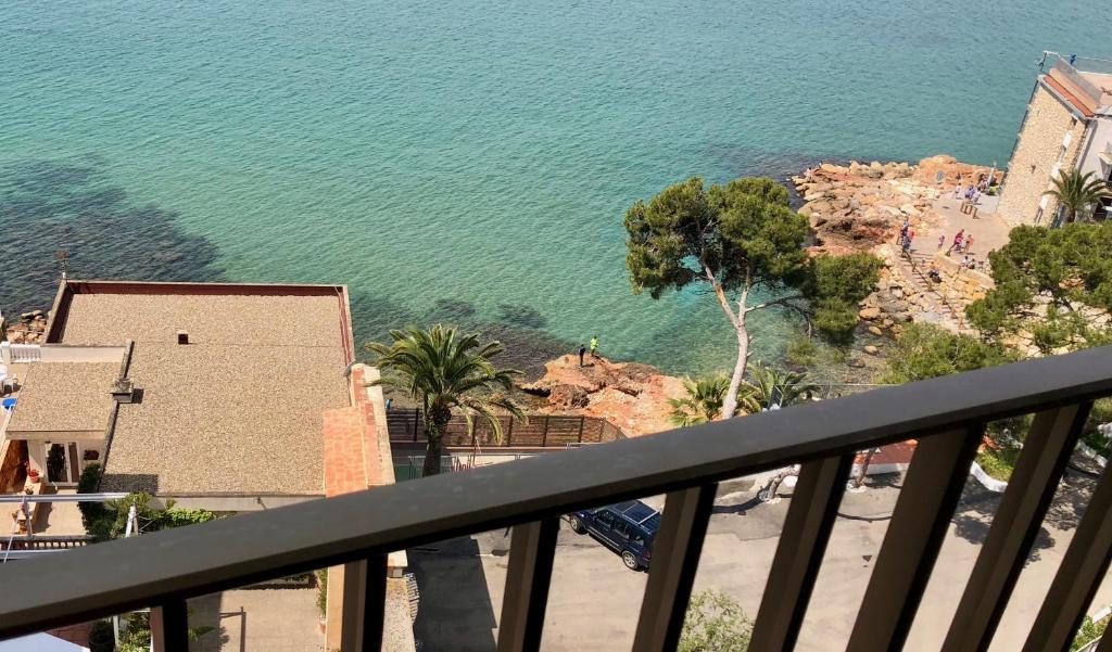 a view of the ocean from a balcony at Apartamento moderno nautilus (Playa Capellans) in Salou