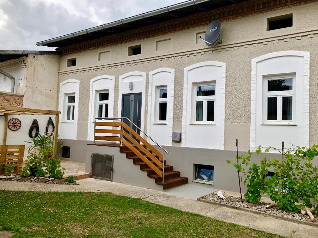 a house with a staircase on the side of it at Riesling House Laa in Laa an der Thaya