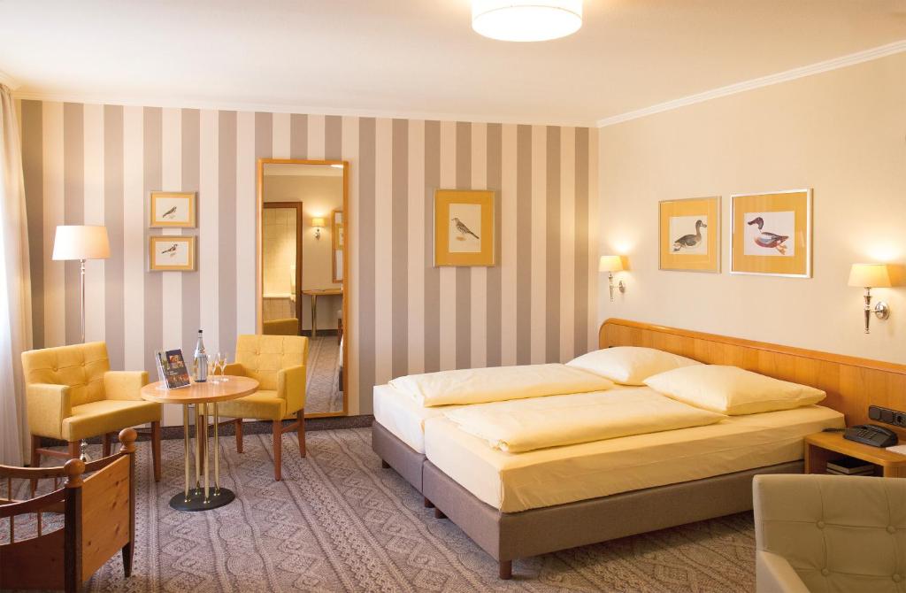 Postel nebo postele na pokoji v ubytování Hotel Reichsküchenmeister
