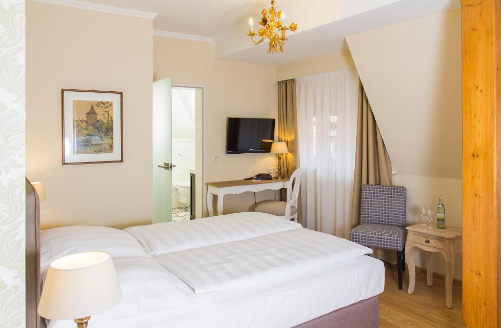 Postel nebo postele na pokoji v ubytování Hotel Reichsküchenmeister