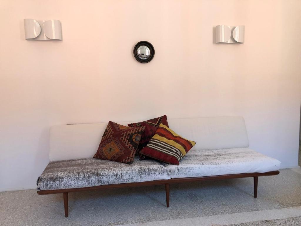 a white couch with pillows on it in a room at Ca' Dorina Luxury in Venice