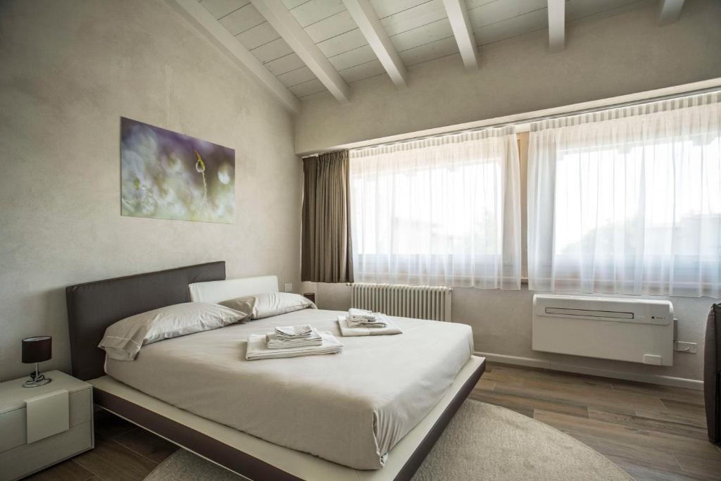 Posteľ alebo postele v izbe v ubytovaní Relais Madergnago