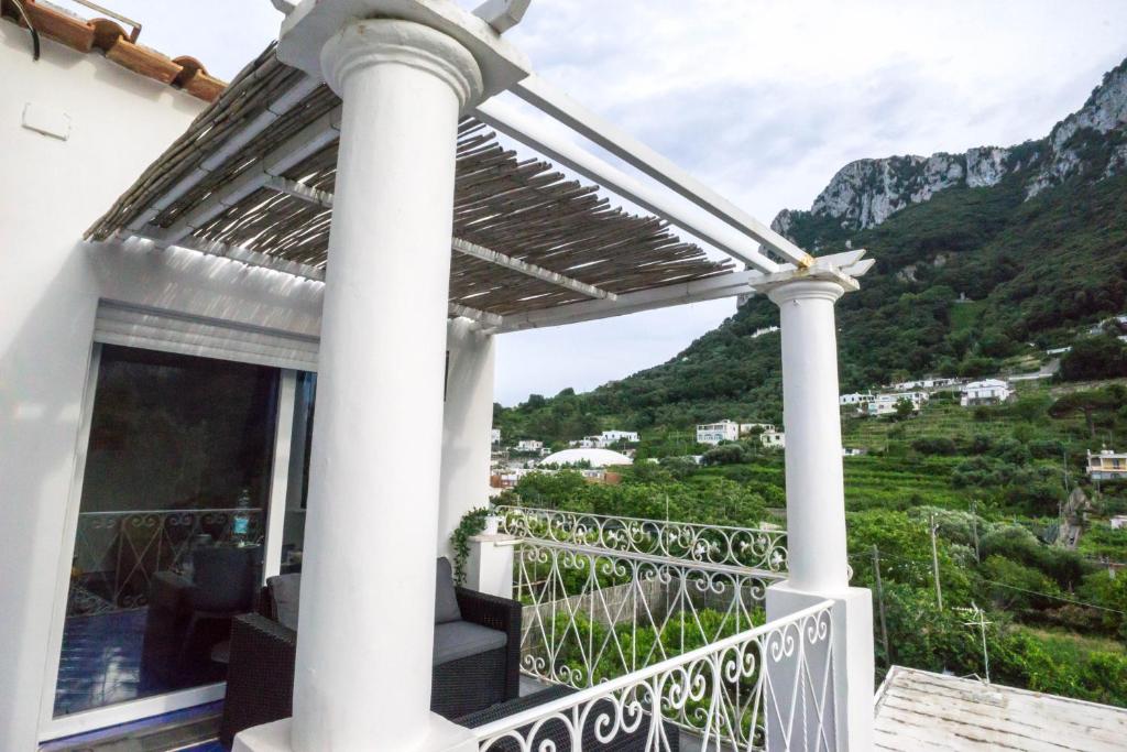 a balcony with a view of a mountain at Casa del Mare in Capri