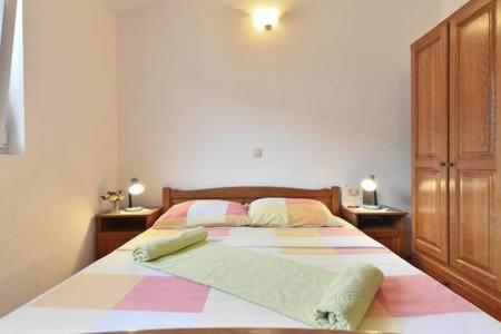Posteľ alebo postele v izbe v ubytovaní Apartmani Mlikotić