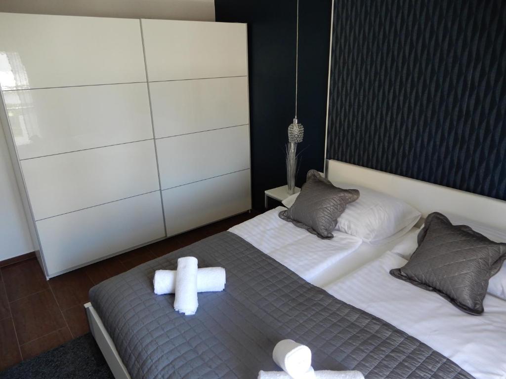 Posteľ alebo postele v izbe v ubytovaní Apartman Nia