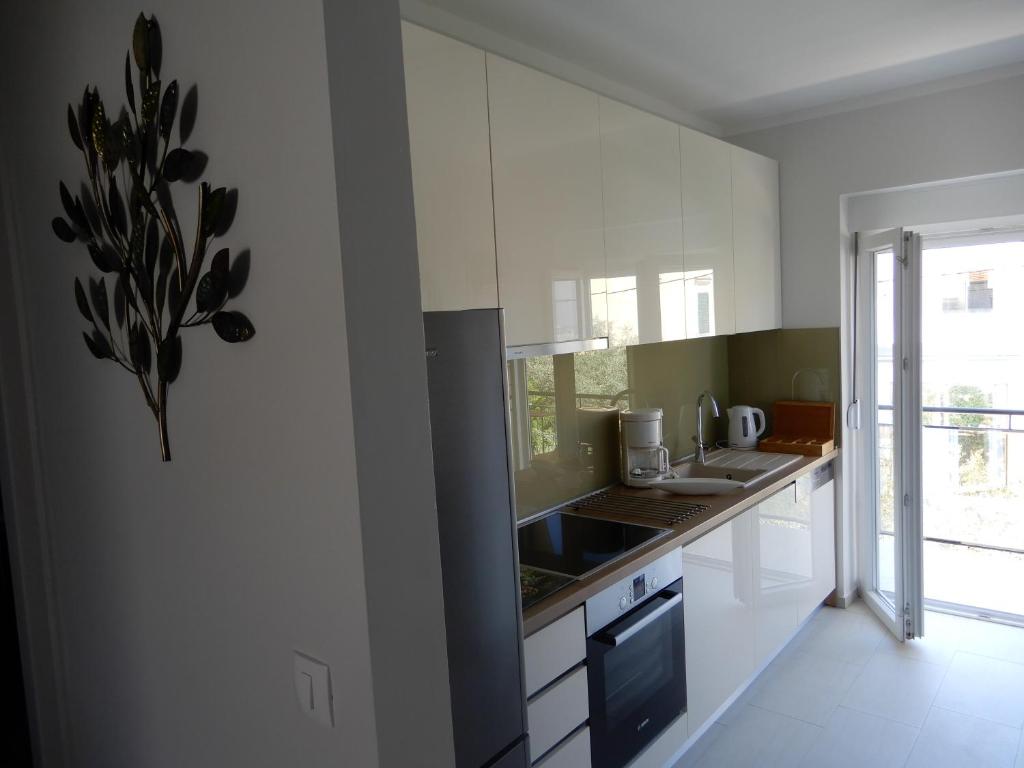 Kuchyňa alebo kuchynka v ubytovaní Apartman Nia