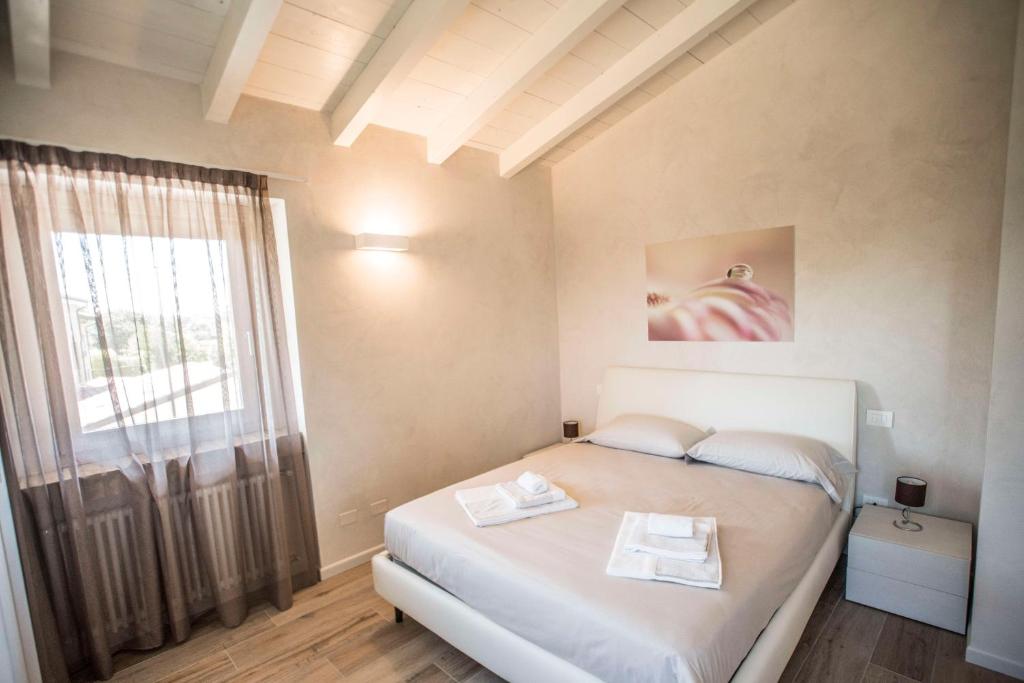 Posteľ alebo postele v izbe v ubytovaní Relais Madergnago