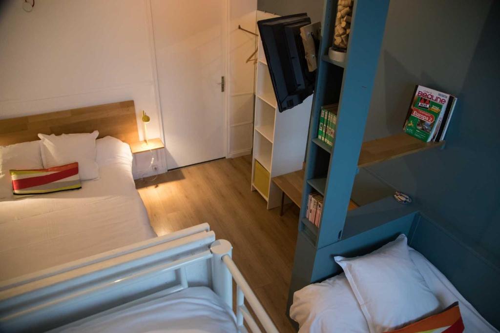 Postel nebo postele na pokoji v ubytování Hôtel Les Hauts de Meursault