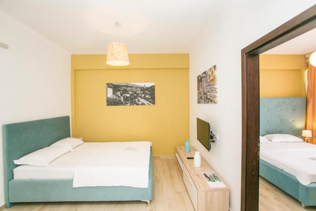 Postel nebo postele na pokoji v ubytování Aparthotel & Spa KASMI
