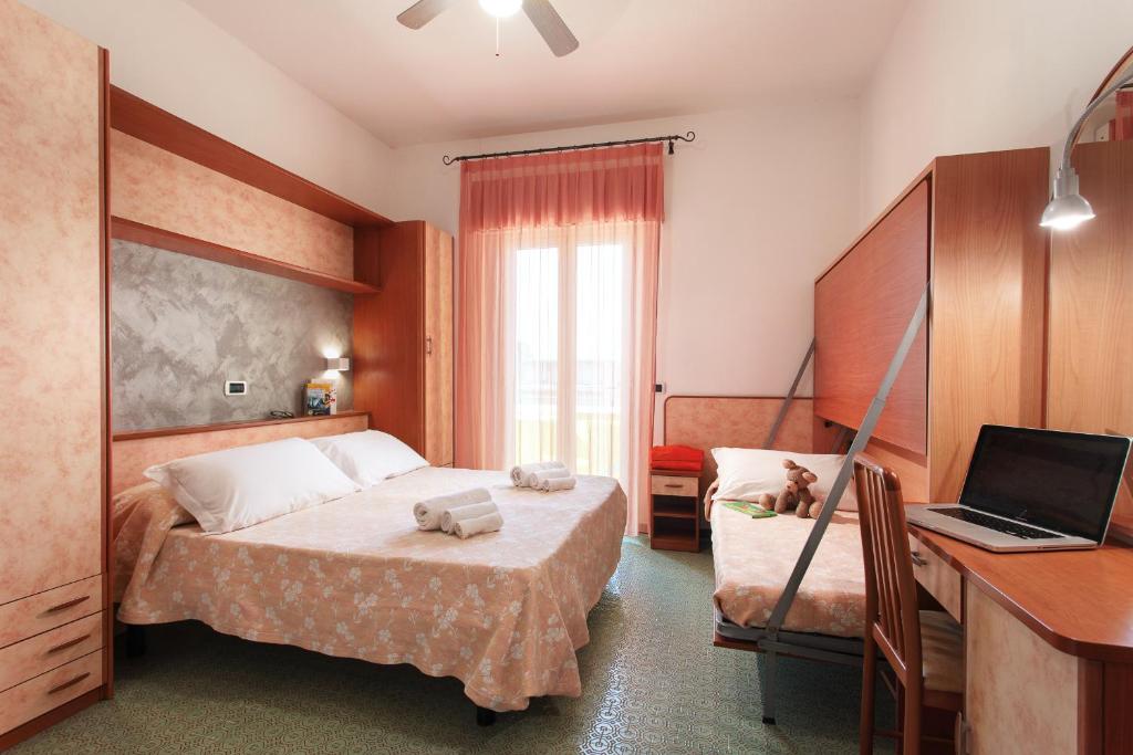 Postel nebo postele na pokoji v ubytování Hotel Sandra