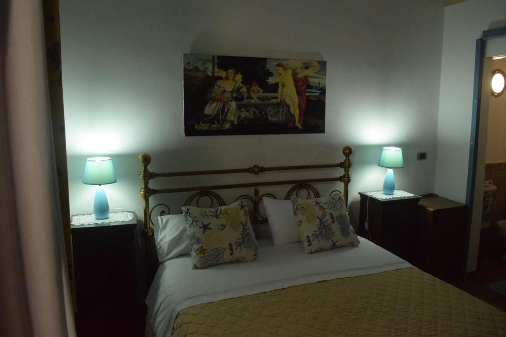 A bed or beds in a room at B&b Lemon Garden
