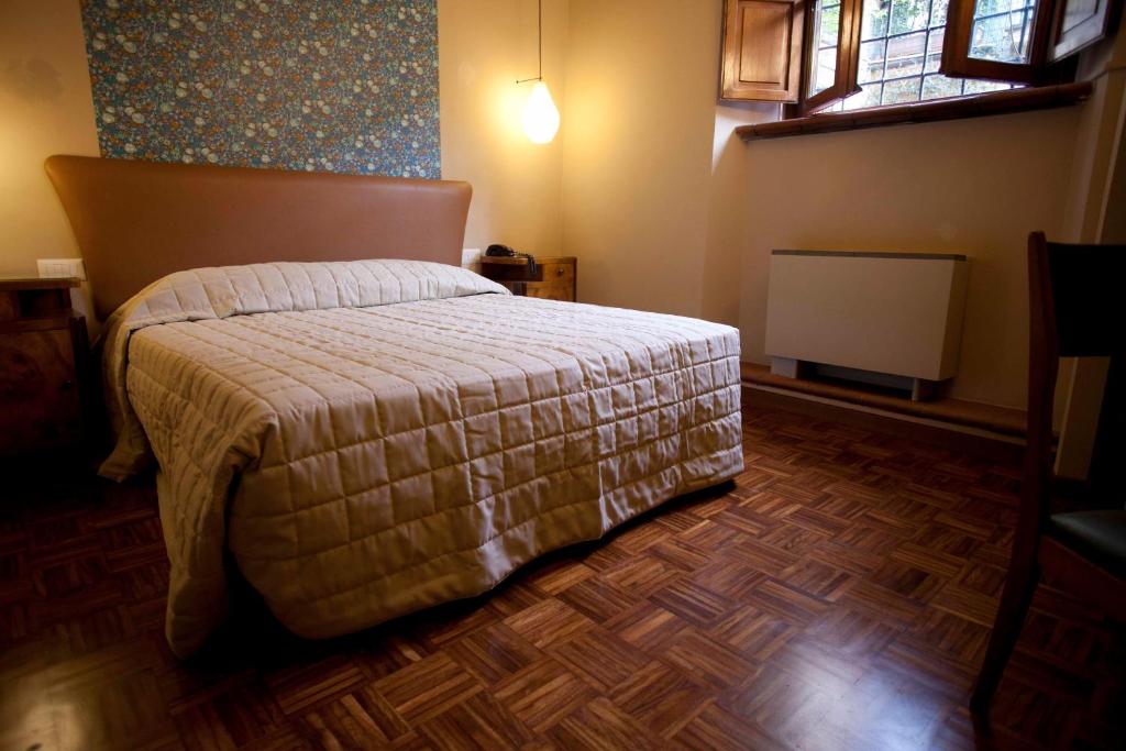 Postel nebo postele na pokoji v ubytování Hotel Diana & Depandance