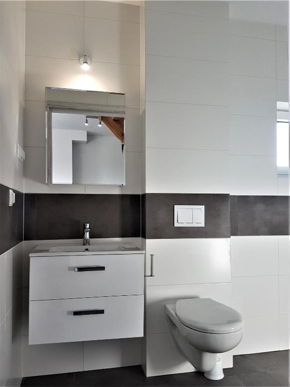Koupelna v ubytování Apartamenty Tęczowa 14 Sarbinowo