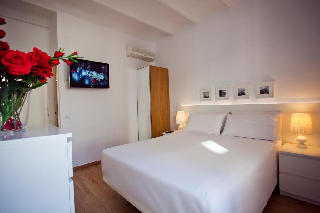 Postel nebo postele na pokoji v ubytování Ramblas Apartments