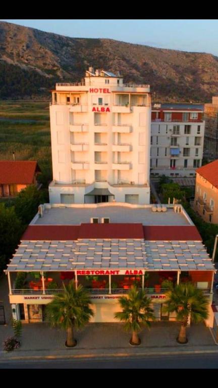 a large building with a lot of solar panels on it at Hotel Alba in Shëngjin