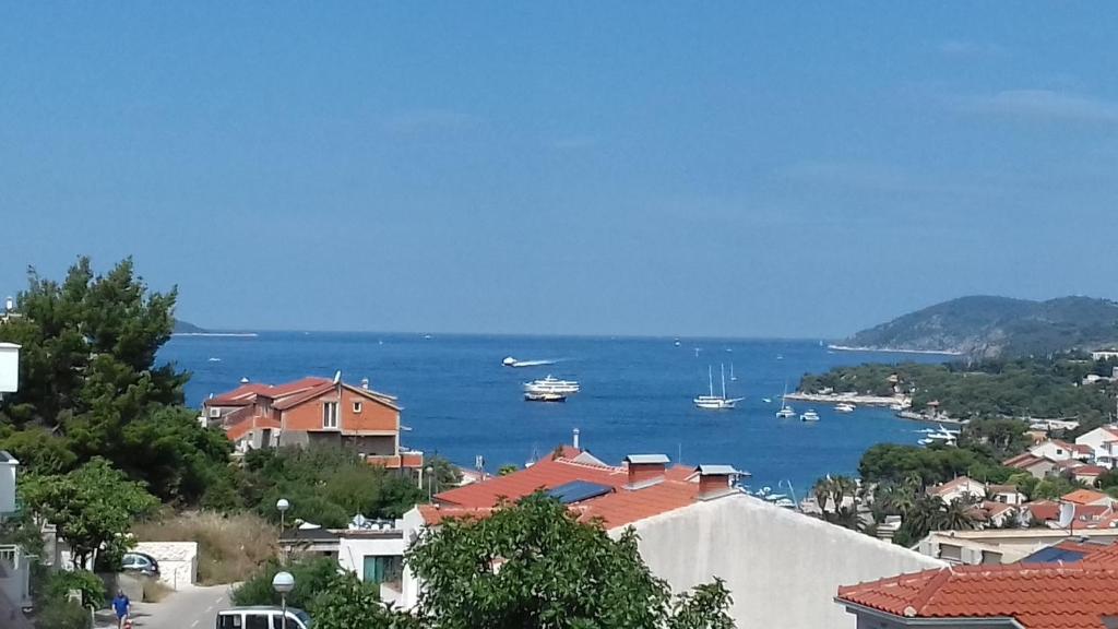 a view of a city with boats in the water at Apartments Sanja in Hvar