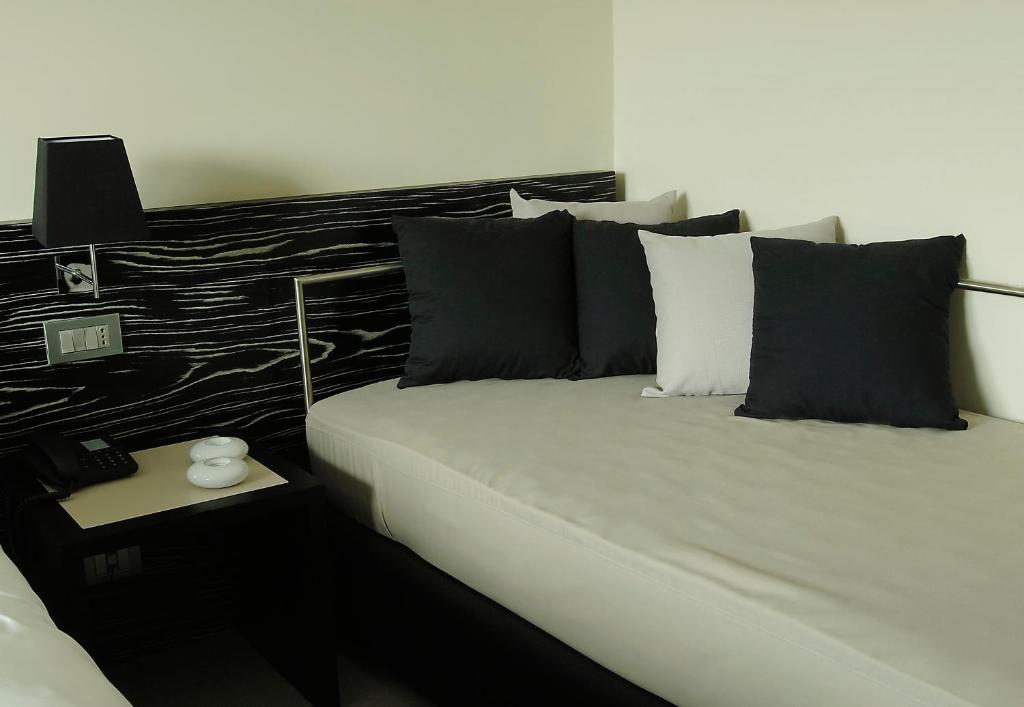 Postel nebo postele na pokoji v ubytování G Hotel Ancona