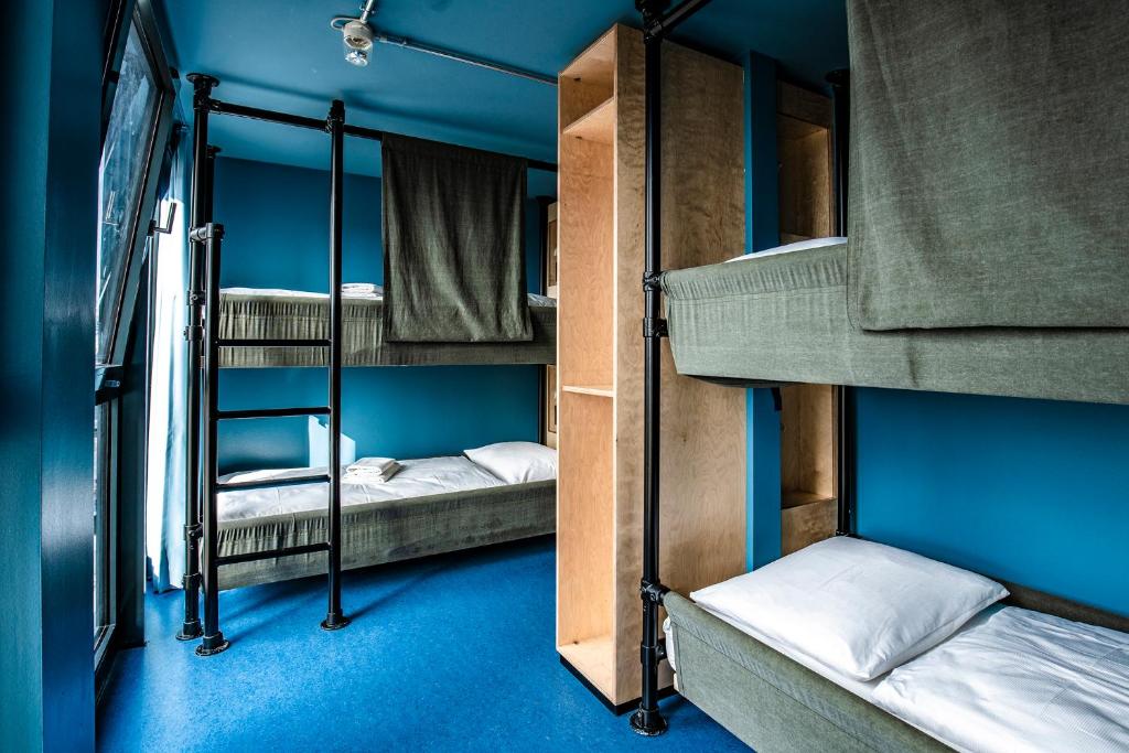 Postel nebo postele na pokoji v ubytování DOCK INN Hostel Warnemünde