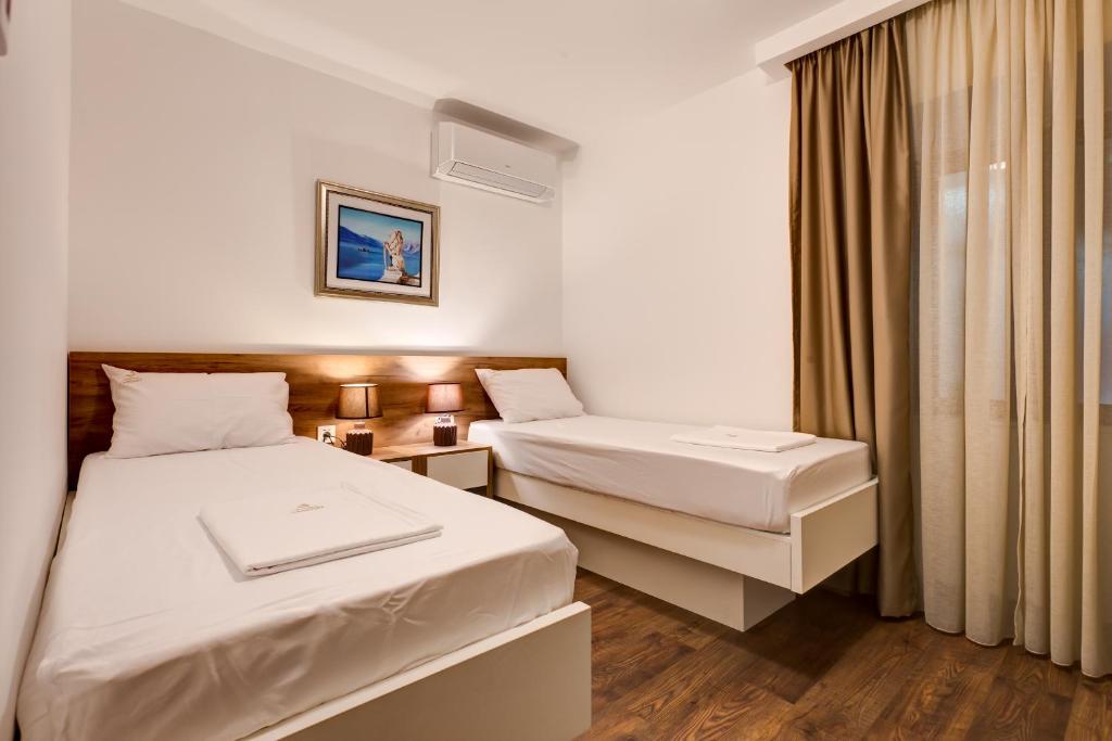 Postel nebo postele na pokoji v ubytování Apartments PROVA