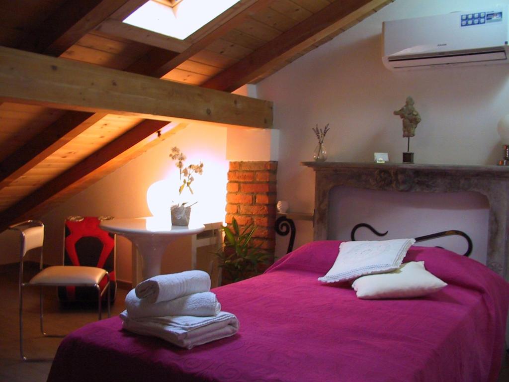 Postel nebo postele na pokoji v ubytování B&B Il Rustico