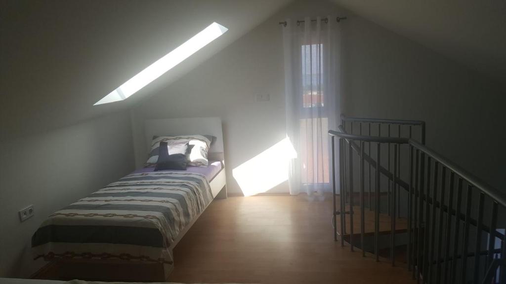 Łóżko lub łóżka w pokoju w obiekcie Apartments Venerea