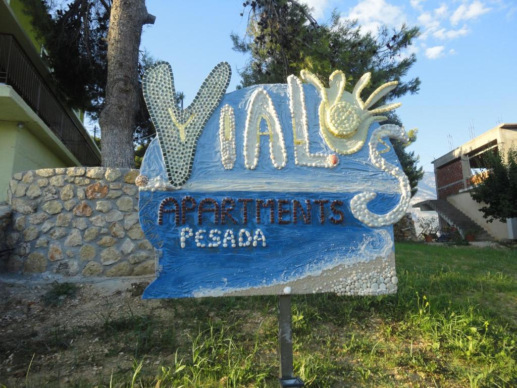 a sign for a waltz entertainment resort at Yialos apartments in Kefallonia