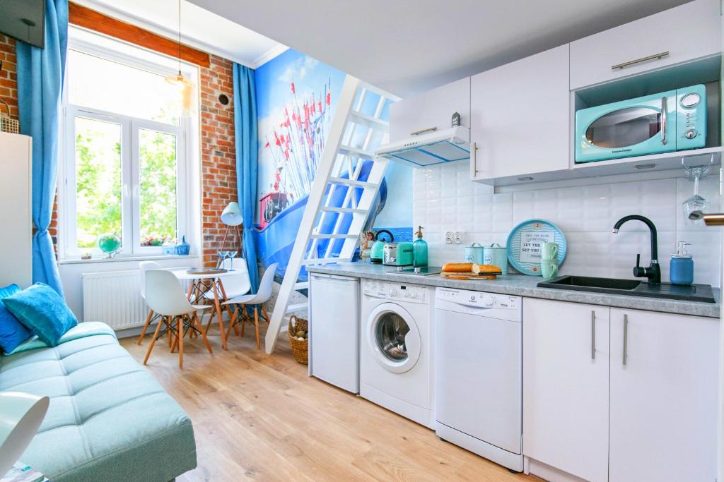 Kuchyňa alebo kuchynka v ubytovaní BERG Apartament BLUE GDANSK
