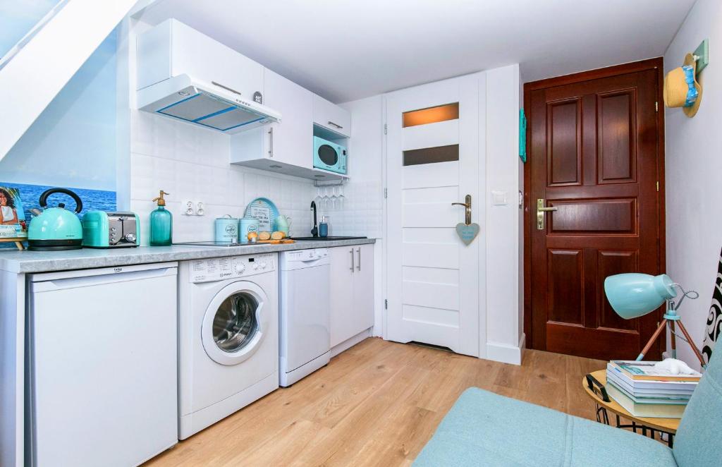 Kuchyňa alebo kuchynka v ubytovaní BERG Apartament BLUE GDANSK