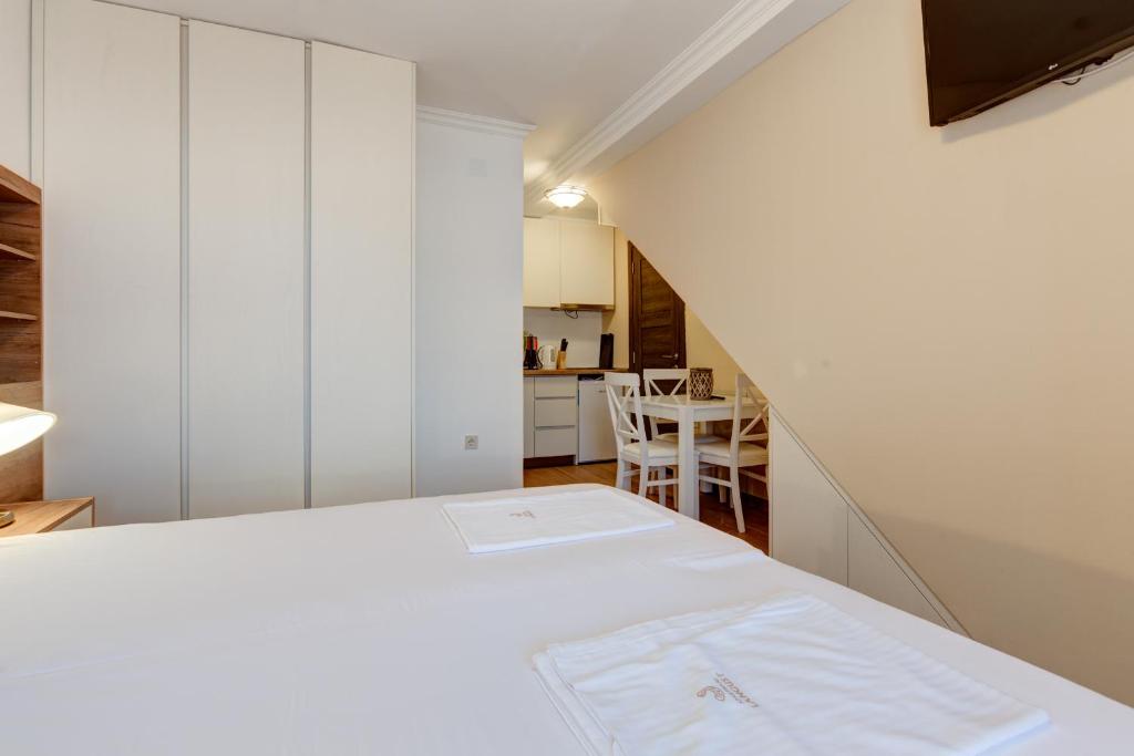 Postel nebo postele na pokoji v ubytování Apartments PROVA