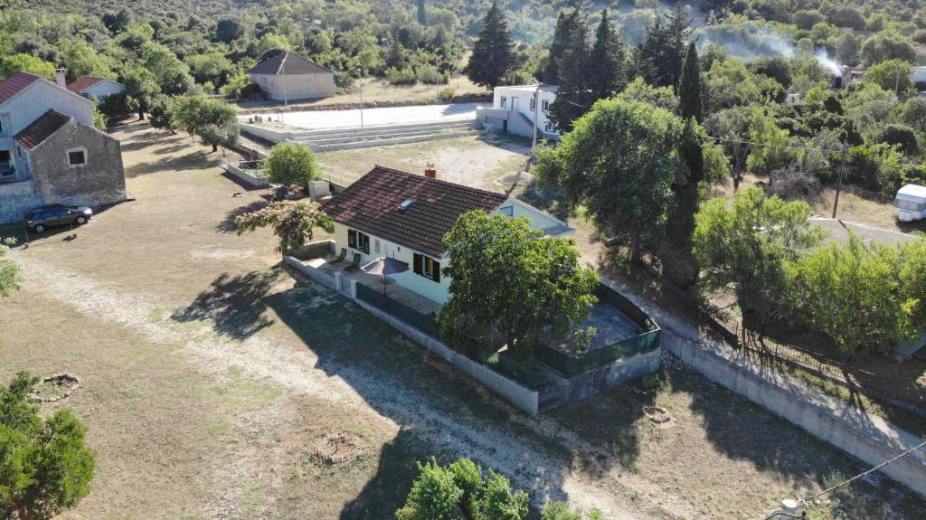 an aerial view of a house with a fence at Vacation home Ivan in Kašić